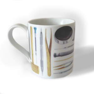 A white mug with straight sides, decorated with watercolour images of watchmaking tools.